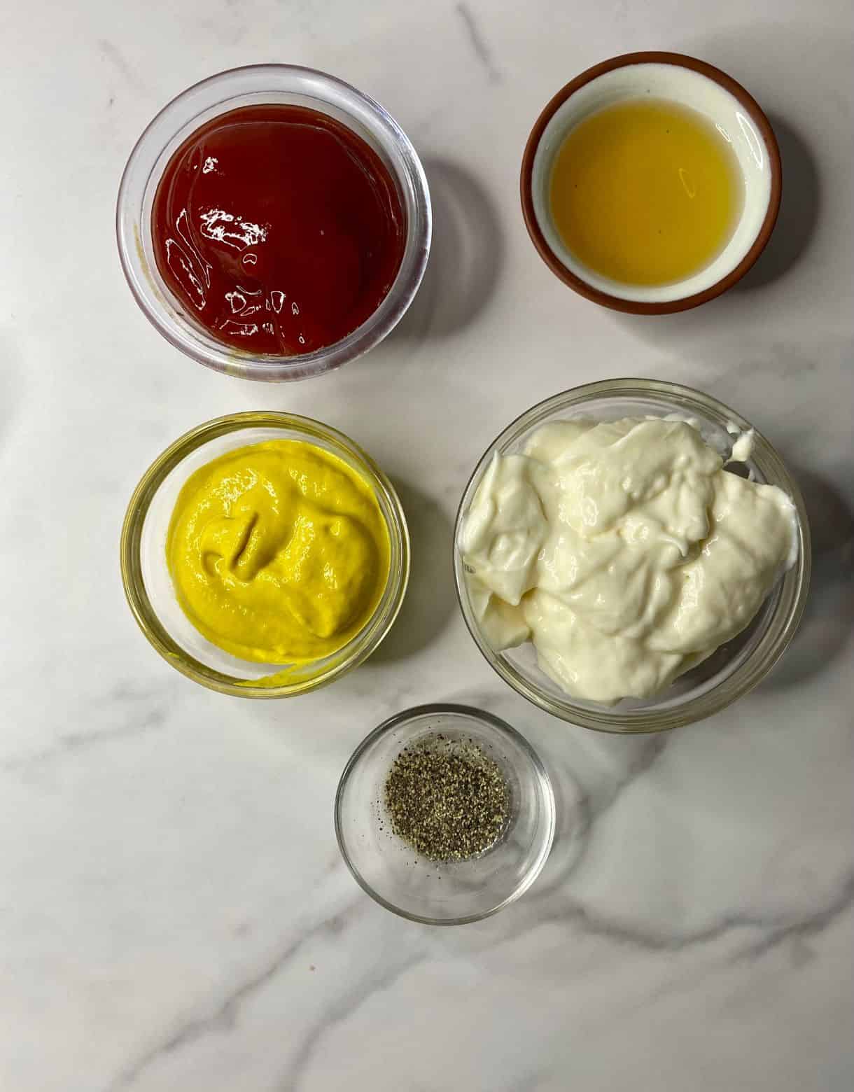 Ingredients for Burger Sauce Dressing. Mayo, ketchup, mustard, black pepper and apple cider vinegar.
