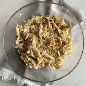 A bowl of shredded chicken.