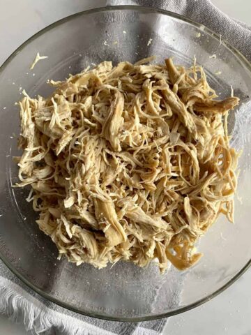 A bowl of shredded chicken.