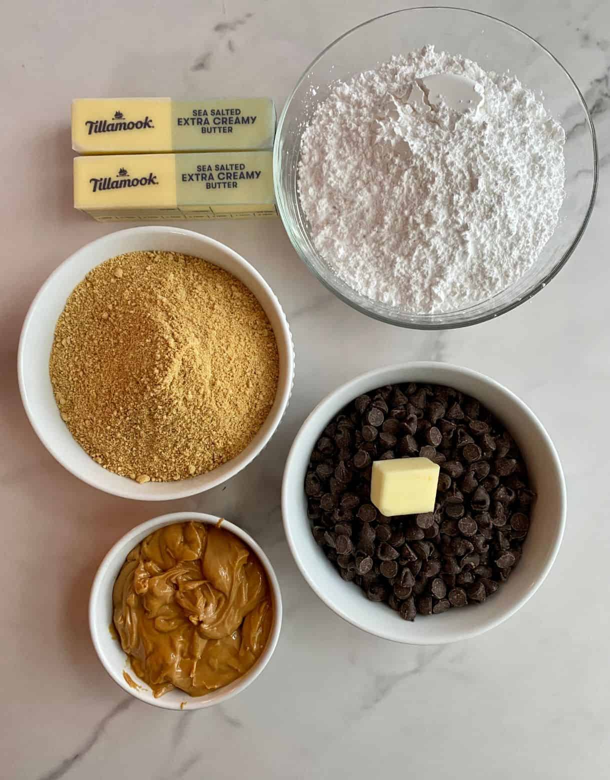 Powdered sugar, graham cracker crumbs, butter, peanut butter and chocolate chips.