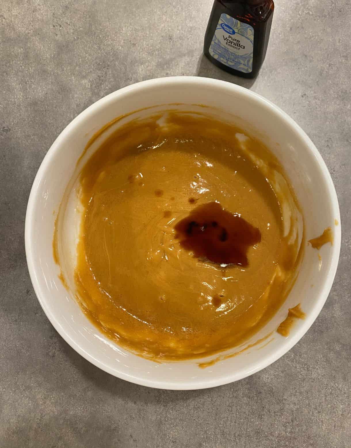 A bowl of melted honey and peanut butter with vanilla added.