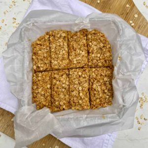 A pan of No-Bake Peanut Butter Granola Bars on a cutting board.