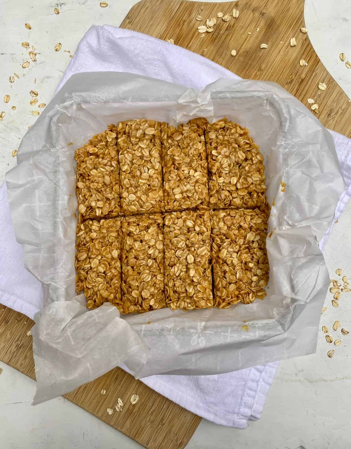 A pan of No-Bake Peanut Butter Granola Bars on a cutting board.