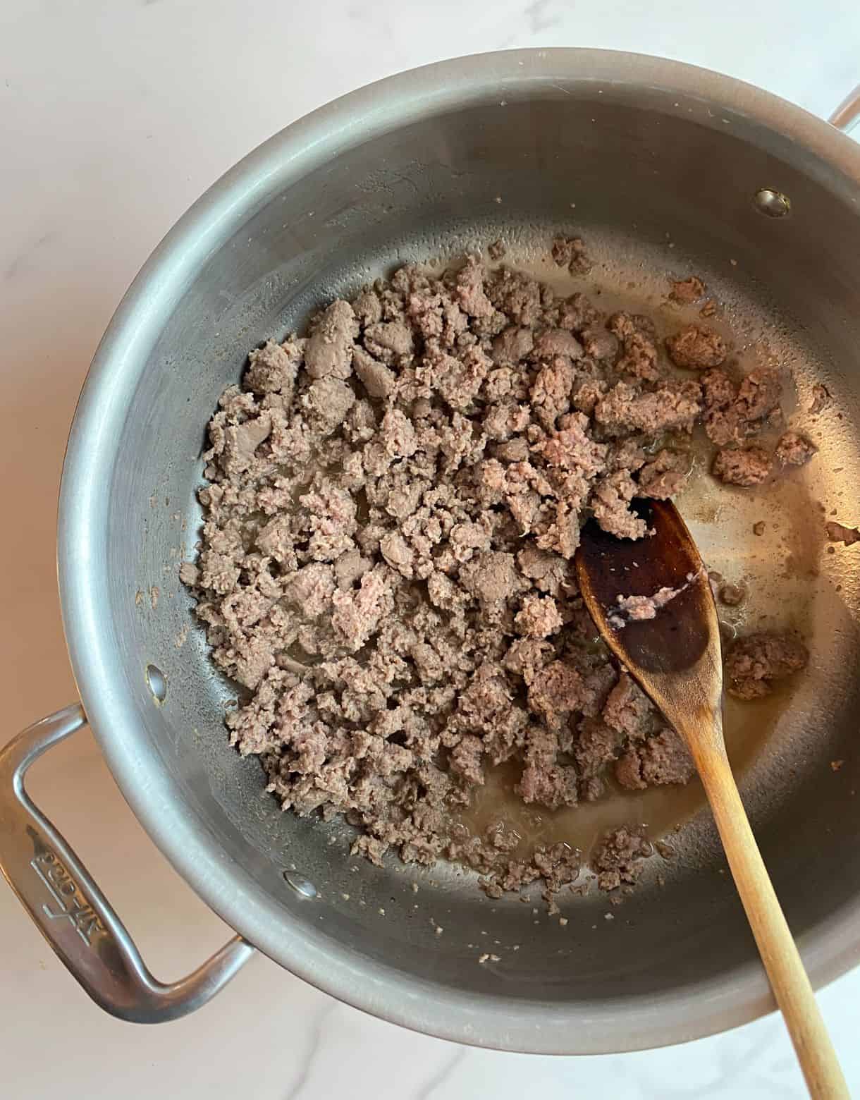 Cooked sausage in a pot.