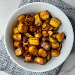 A bowl of cooked Sesame Tofu.