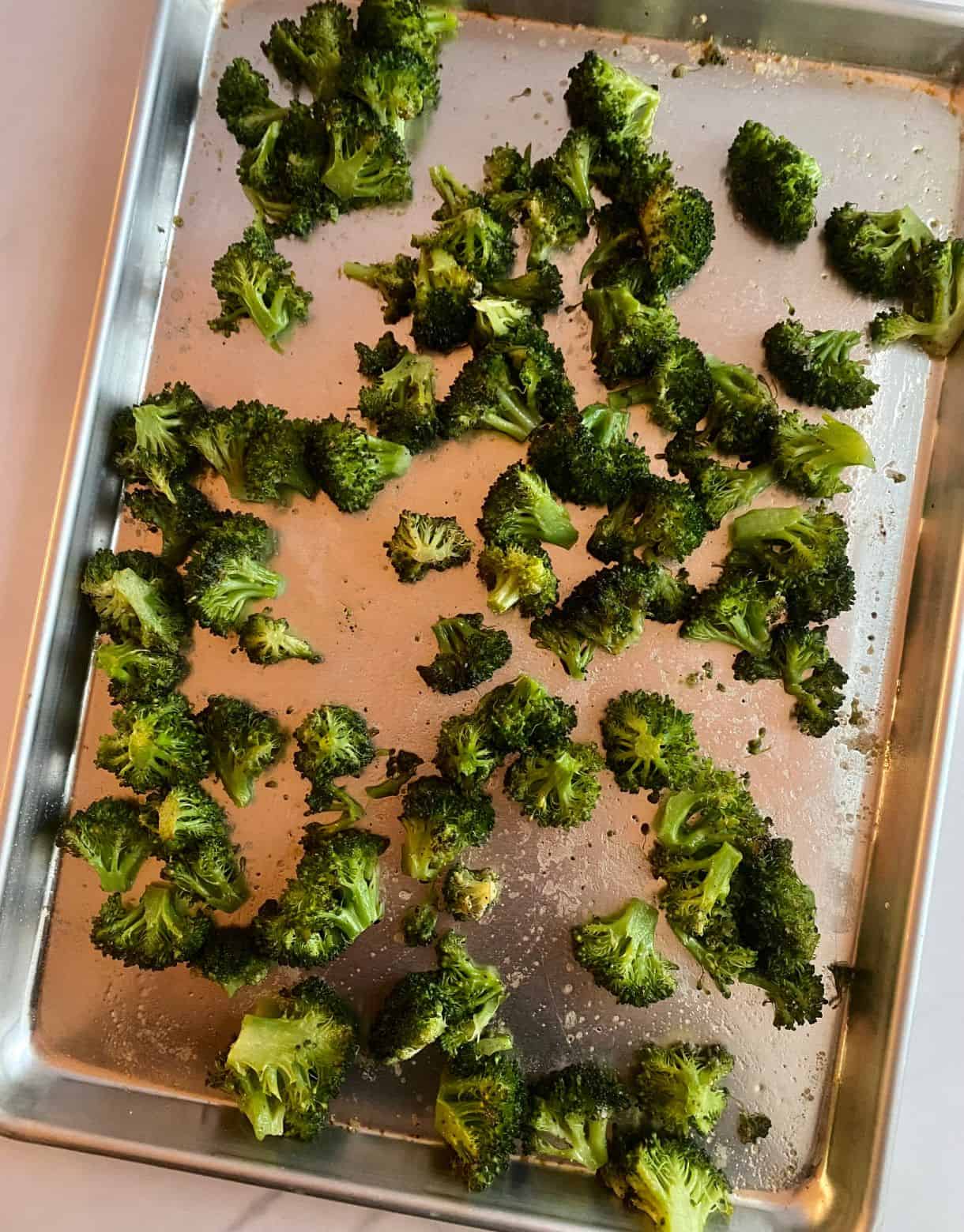 A sheet pan of roasted broccoli.