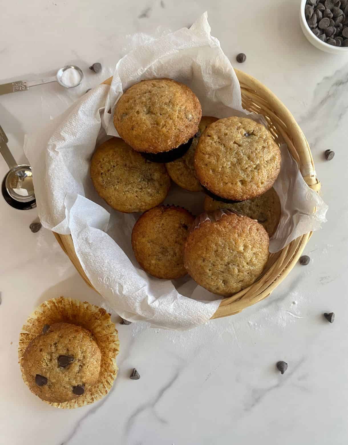 A basket of Healthy Banana Chocolate Chip Muffins.