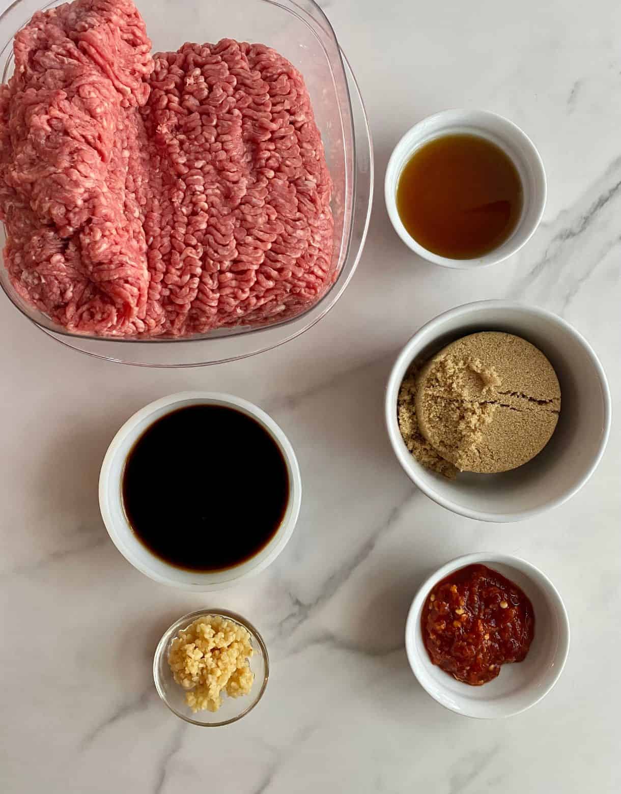 Ground beef, sesame oil, soy sauce, brown sugar, minced garlic and chili garlic sauce.