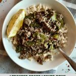 A Lebanese Grape Leaves Bowl with a wedge of lemon.