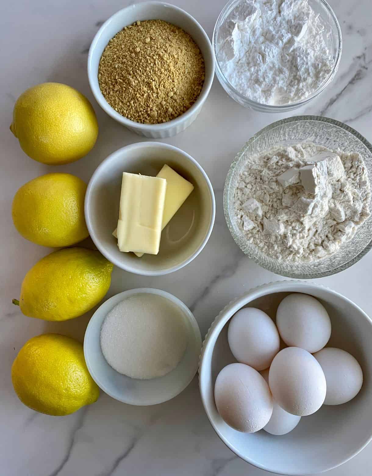 Fresh lemons, graham cracker crumbs, butter, eggs, powdered sugar, flour and sugar.