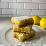 A stack of 3 lemon bars with a graham cracker crust.