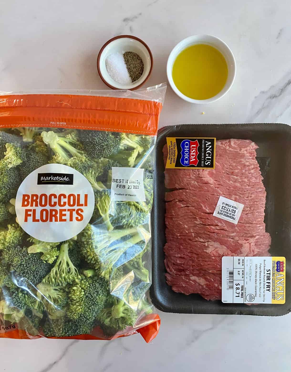 A bag of chopped broccoli, thinly sliced beef, olive oil, salt and pepper.