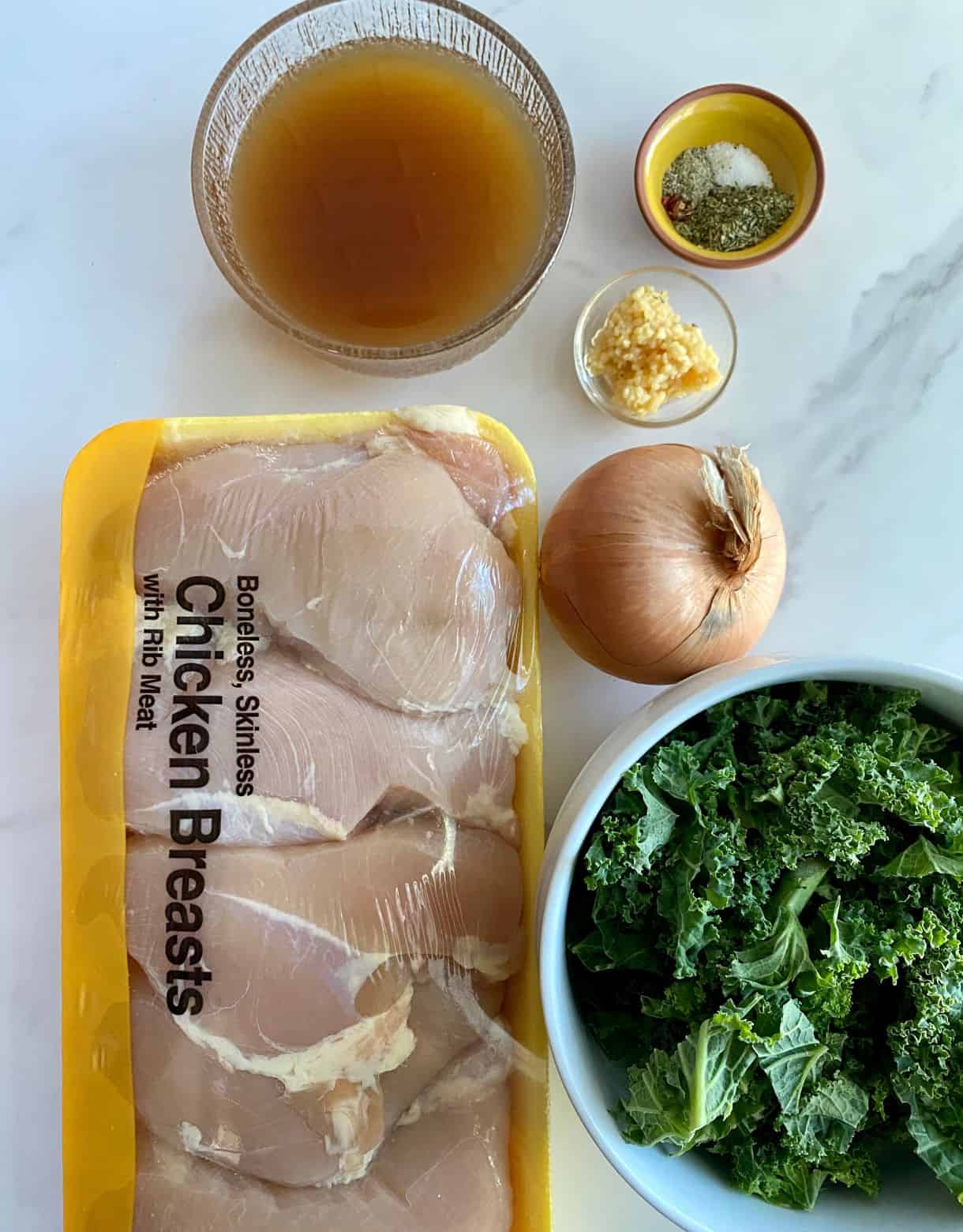 Chicken breasts, kale, onion, chicken broth, minced garlic, salt, pepper and Italian seasoning.