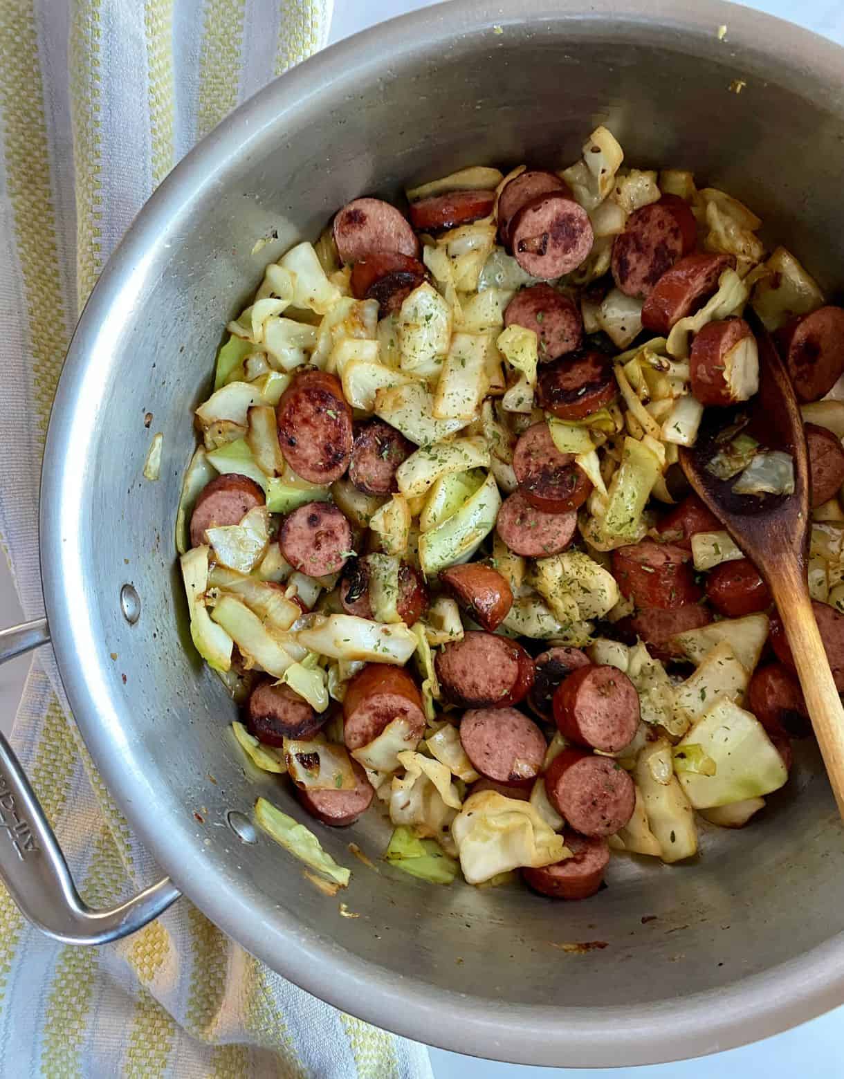 A skillet of cooked Southern Fried Cabbage with Sausage.