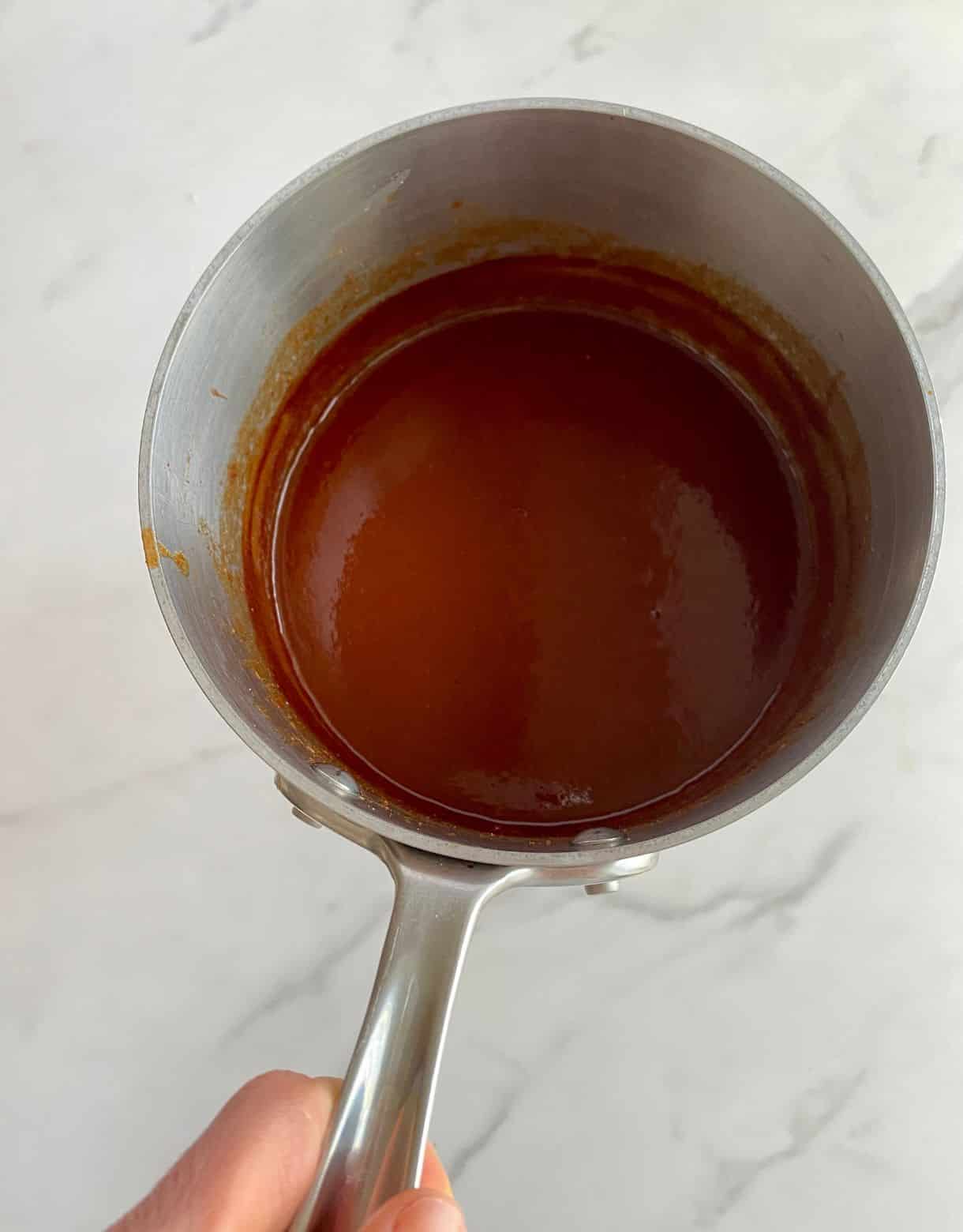 A pot of finished Sweet and Spicy BBQ Sauce.