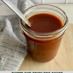 A jar of Sweet and Spicy BBQ Sauce with a spoon.