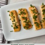 A platter with four pieces of cooked Sweet Chili Salmon topped with green onions and the Healthy Mom Healthy Family logo.