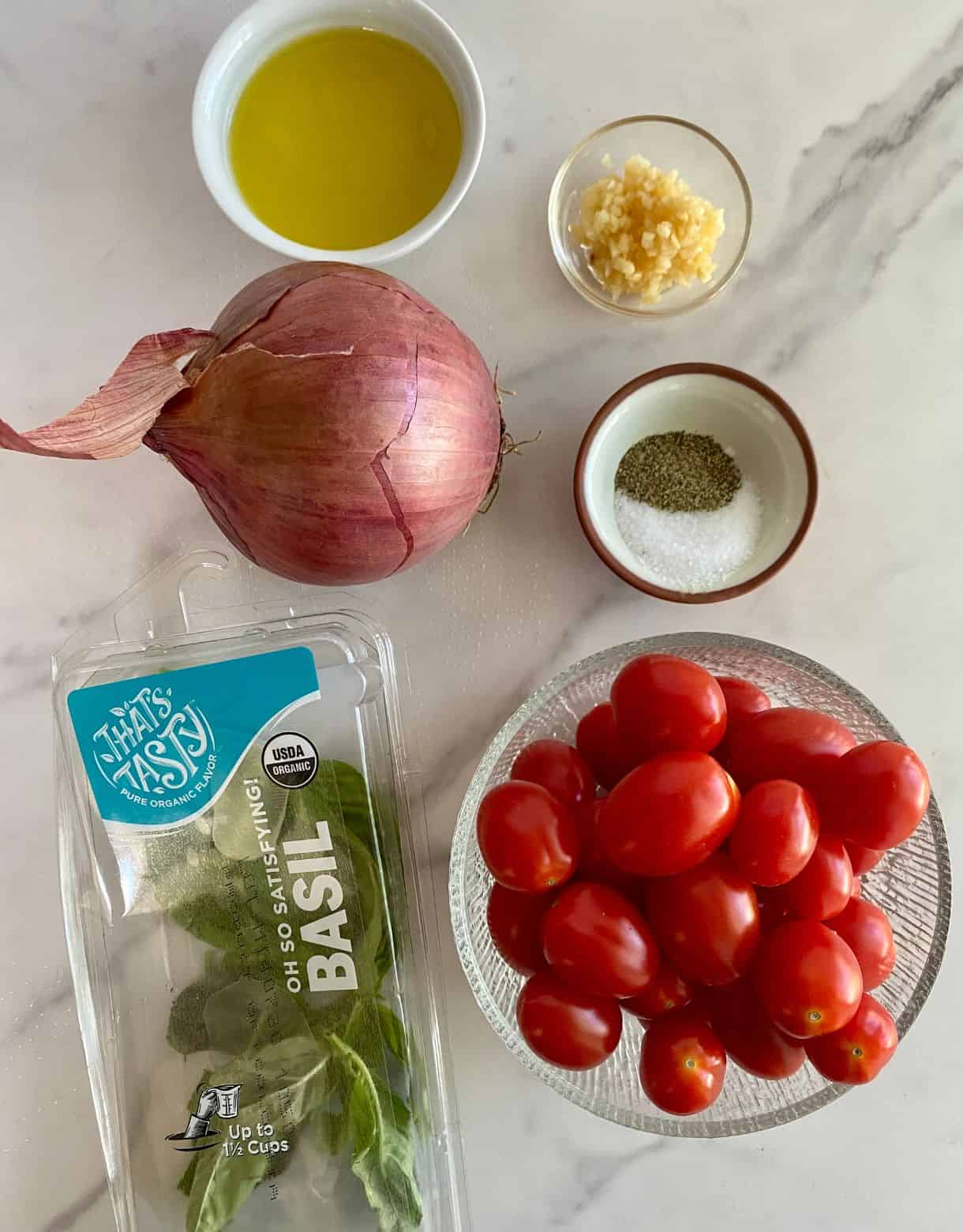 Olive oil, garlic, red onion, salt, pepper, basil and grape tomatoes.