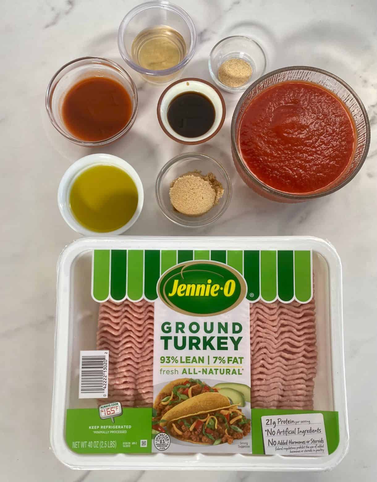 Ingredients for Buffalo Sloppy Joe's. Ground turkey, tomato sauce, olive oil, brown sugar, hot sauce, Worcestershire sauce, garlic powder and vinegar.