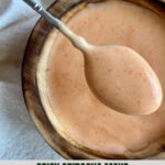 A bowl of Spicy Sriracha Mayo with a spoon.