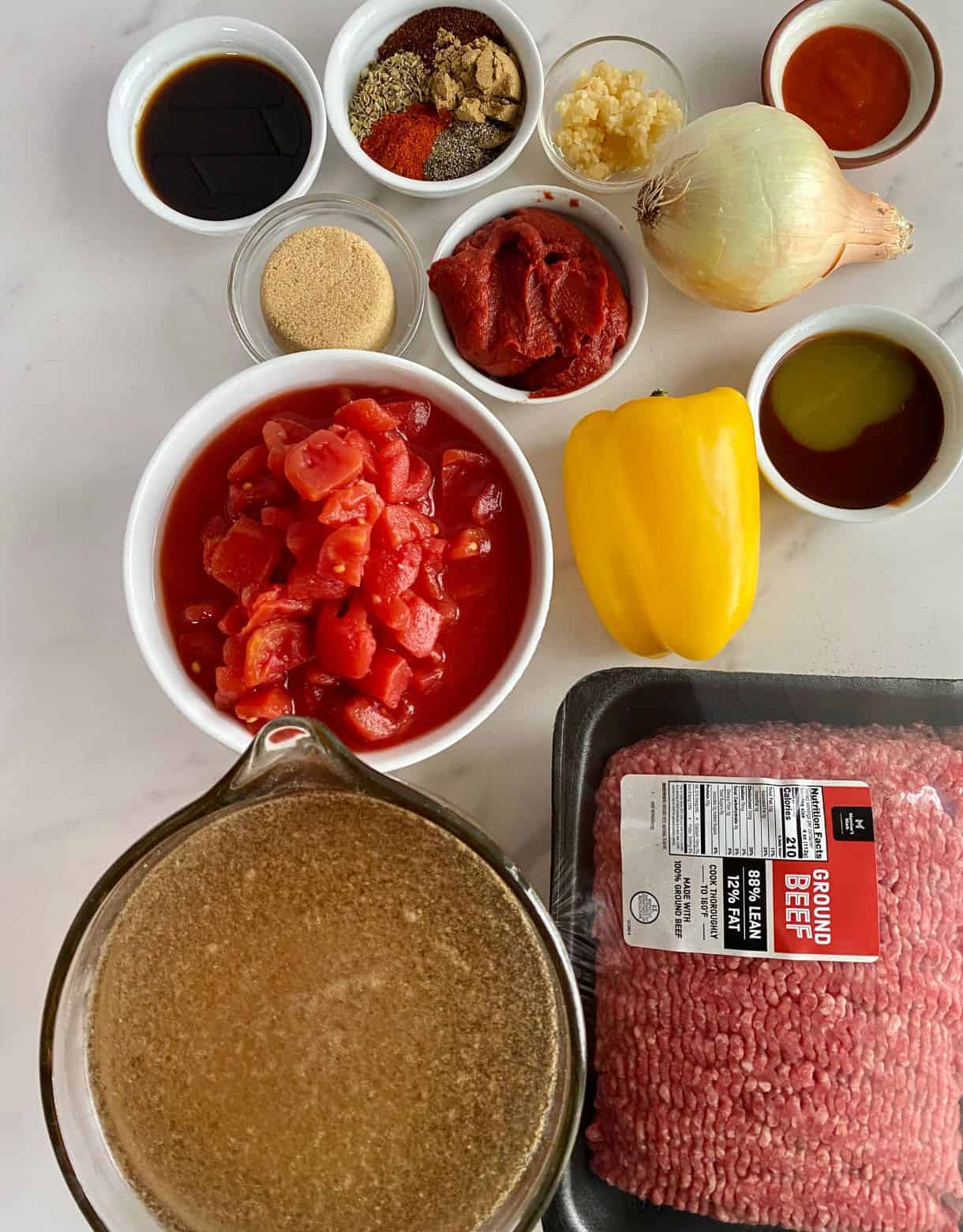 Ingredients for Sweet and Spicy Chili. Ground beef, beef broth, diced tomatoes, bell pepper, onion, garlic, brown sugar, tomato paste, hot sauce, liquid smoke, Worcestershire sauce, chili powder, cumin, smoked paprika, salt and pepper.