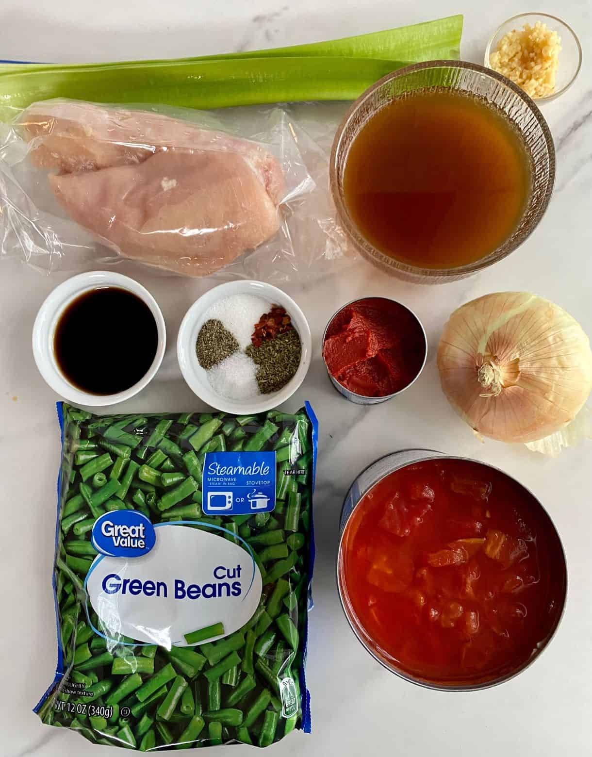Frozen green beans, canned diced tomatoes, an onion, celery, chicken broth, chicken breasts, balsamic vinegar, tomato paste, minced garlic, salt, sugar, black pepper, red pepper flakes and Italian seasoning.