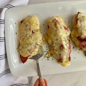A platter with cooked Healthy Chicken Cordon Bleu.