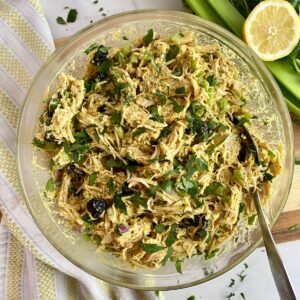 A bowl of Healthy Curried Chicken Salad all mixed together.