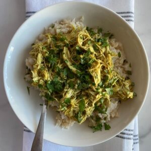 A bowl of Slow Cooker Curry with Coconut Milk over cauliflower rice.