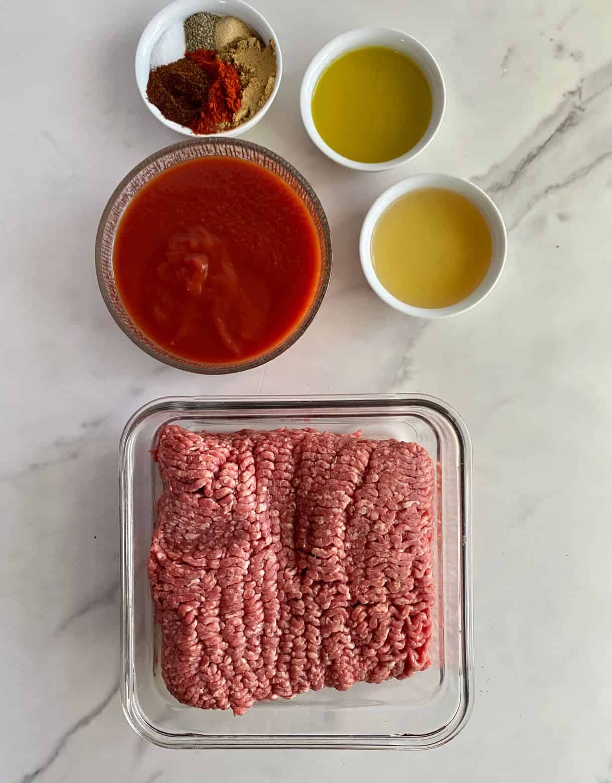 Ground beef, tomato sauce, apple cider vinegar, olive oil and spices.