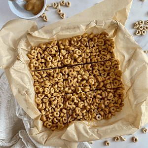 A pan of sliced Peanut Butter Cheerios Bars.