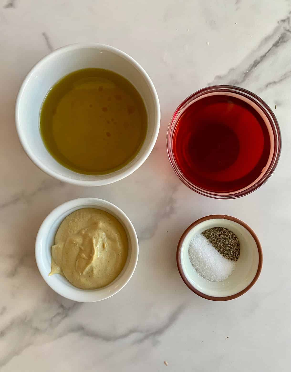 Olive oil, red wine vinegar, Dijon mustard, salt and pepper.