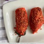 A platter with cooked Takis Chicken.