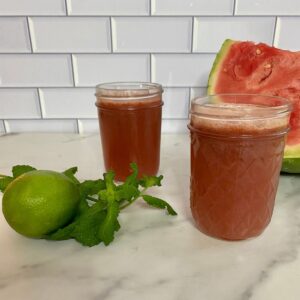 Two glasses of watermelon and cucumber juice.