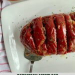 A platter with cooked Parmesan Mealoaf cut into slices.