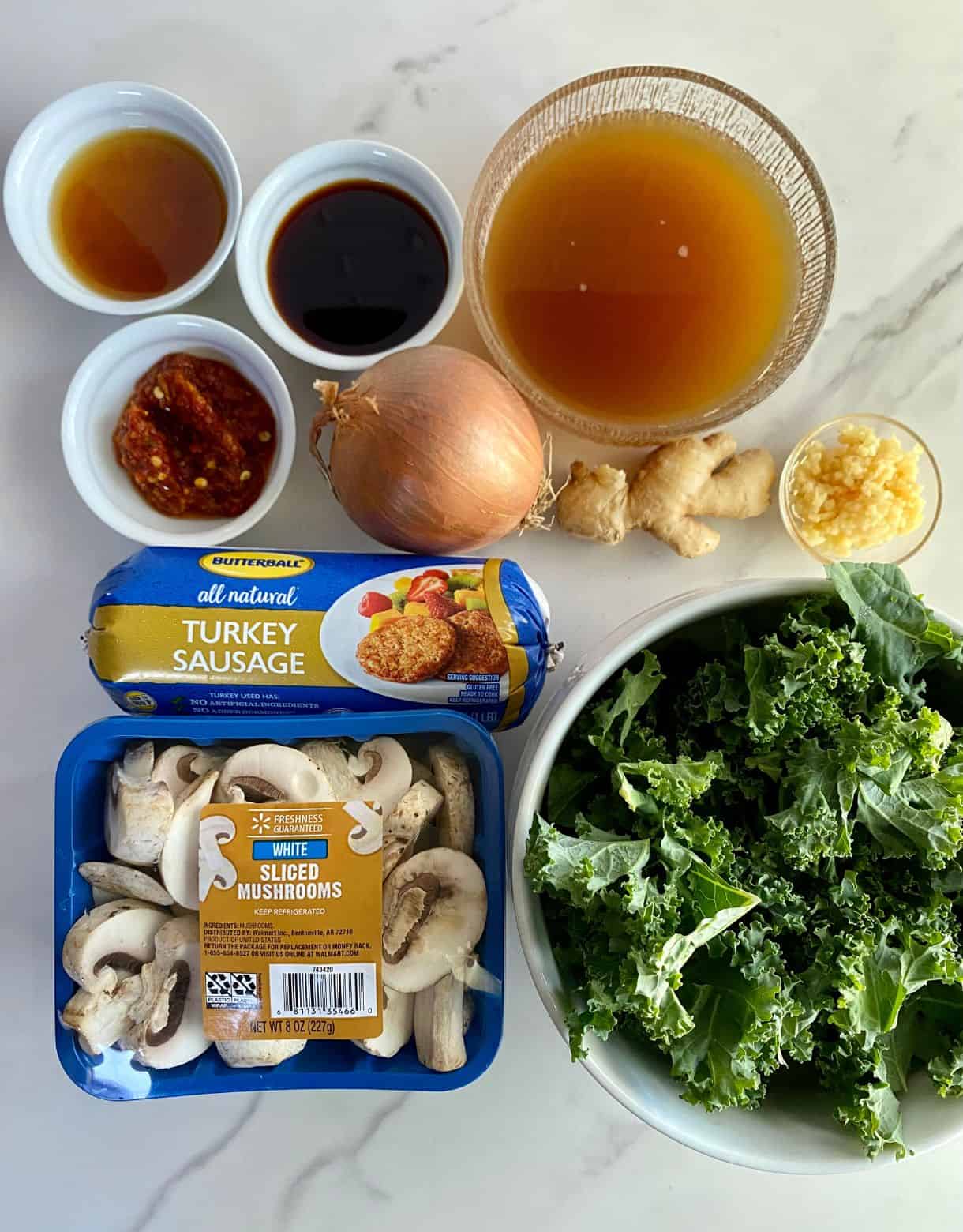Kale, sliced mushrooms, chicken broth, turkey sausage, minced garlic, ginger root, onion, chili garlic sauce, sesame oil and soy sauce.