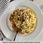A cooked head of Whole Roasted Cauliflower with Cheese.