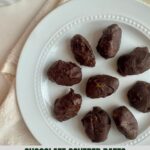 A plate of chocolate covered dates.