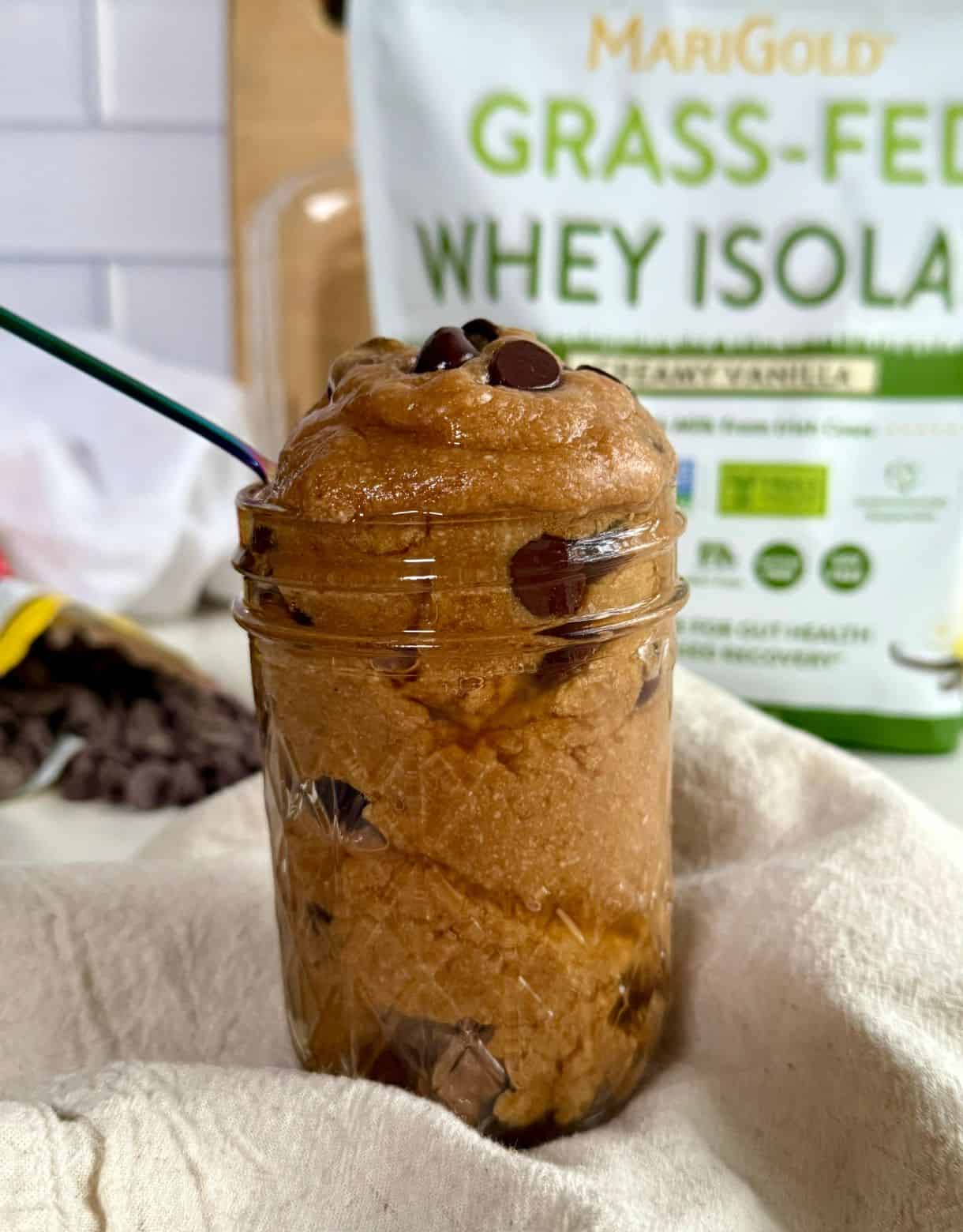 A jar filled with Edible Protein Cookie Dough.